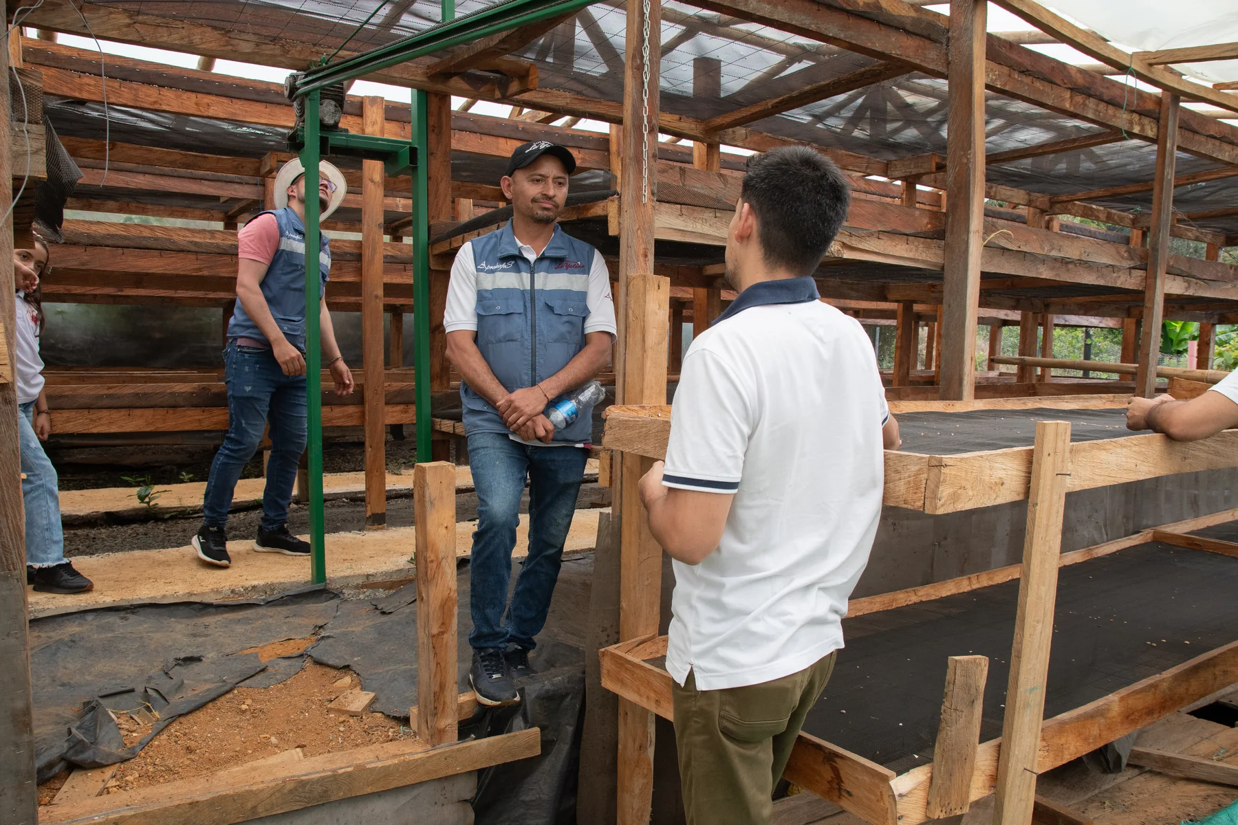 Elkin and Andres at coffee drying beds